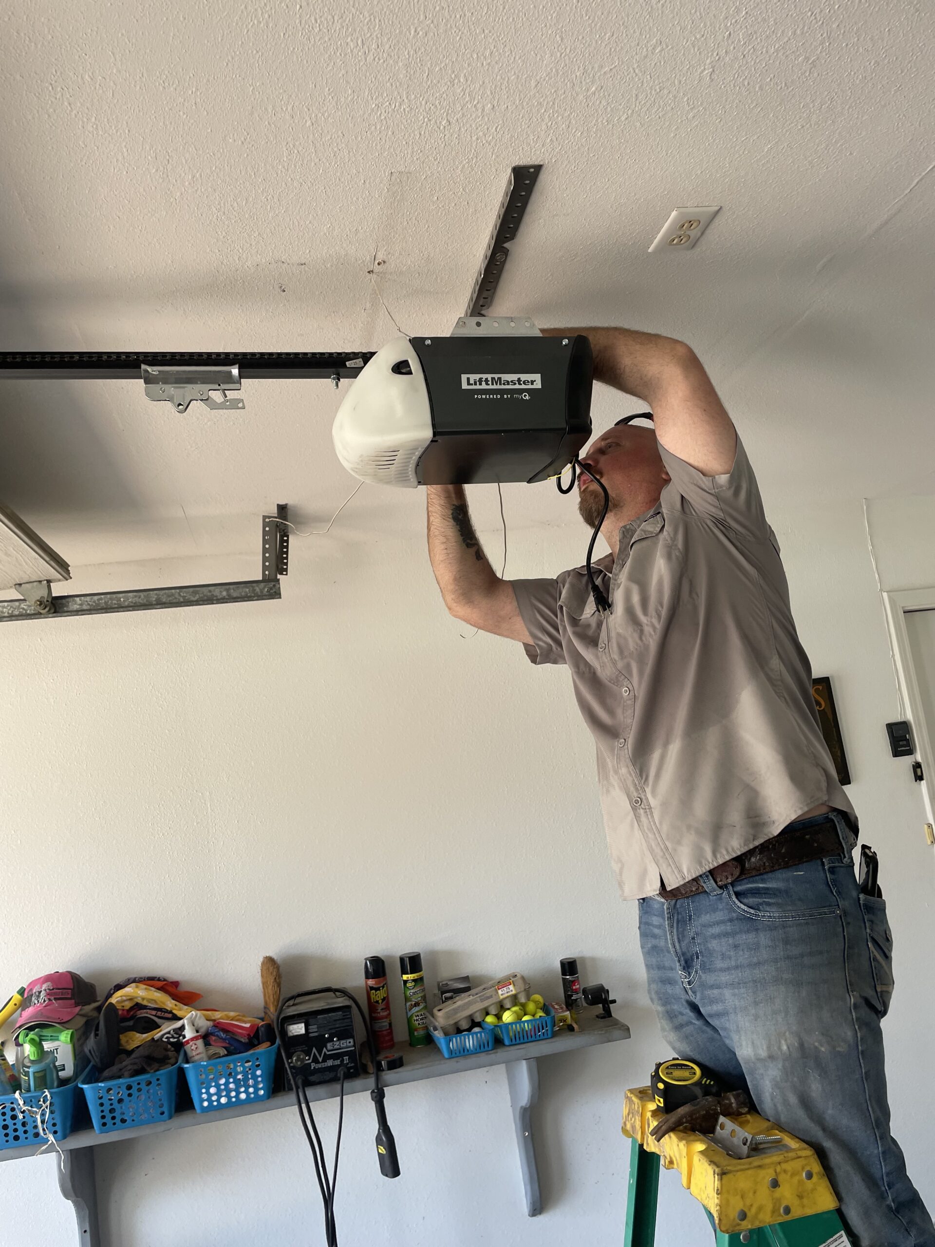 Wood-look garage door with high glass panel in East Texas